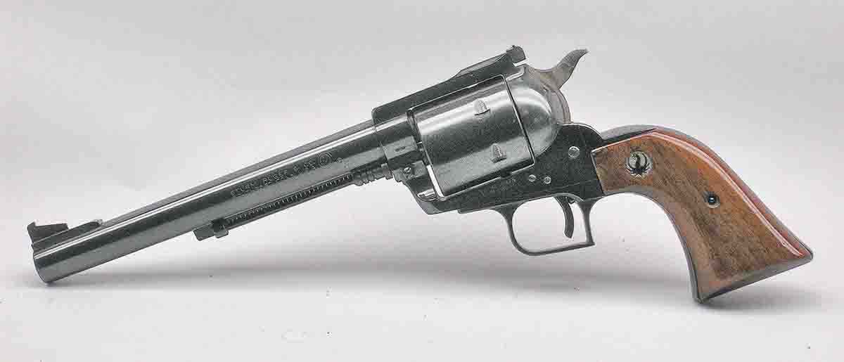This Ruger Super Blackhawk (Old Model serial number 3xx) features the standard Bisley-type hammer, wide serrated trigger, after-market front sight and relatively rare long steel grip frame with original varnished stocks.
